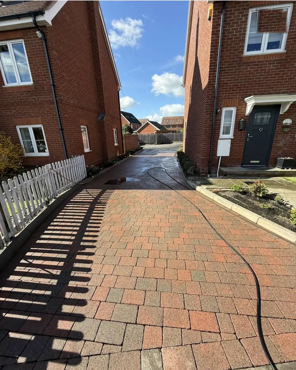 Driveway cleaning by Geyserclean in Milton Keynes, work in progress